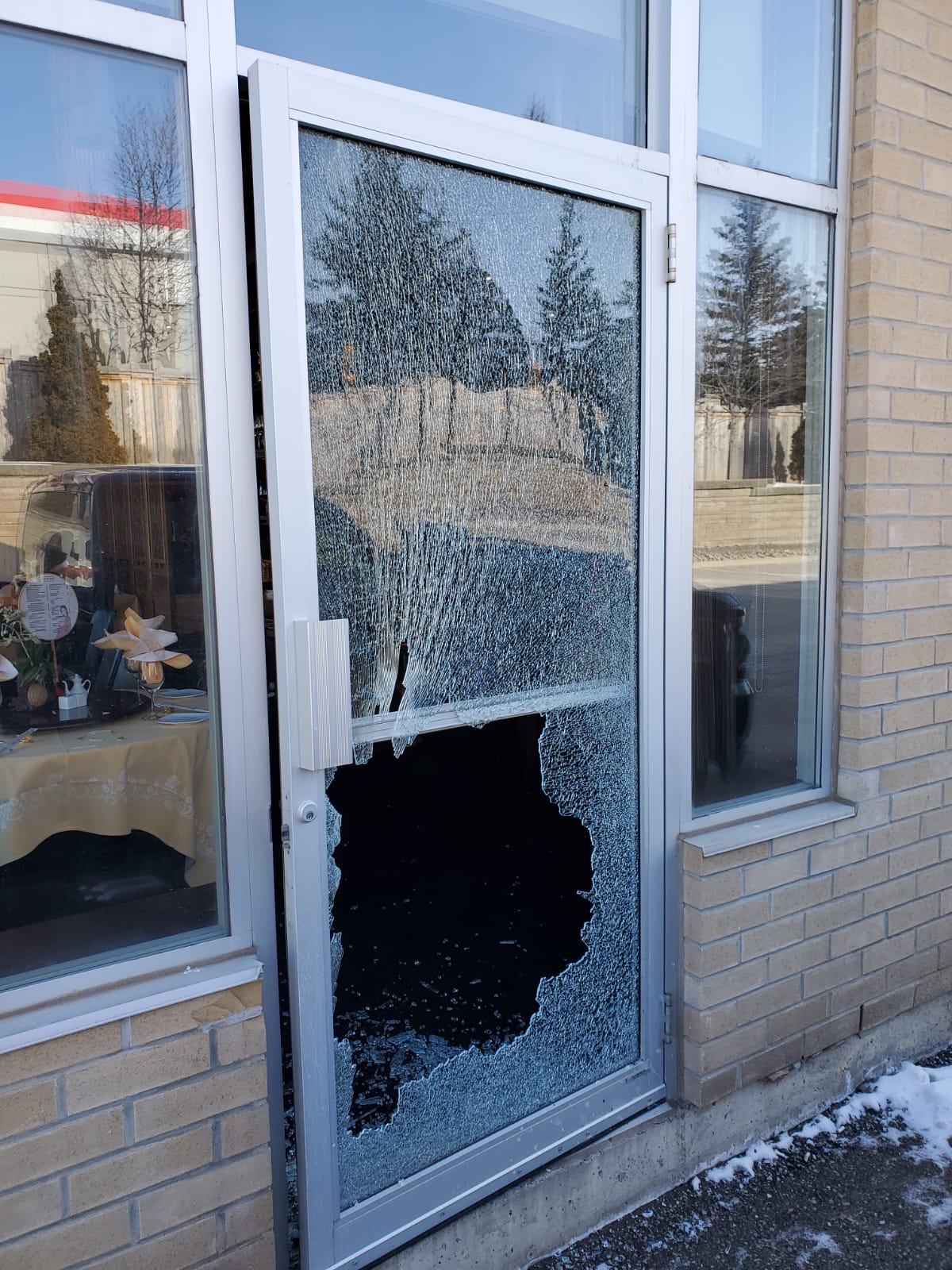 shattered storefront window repair