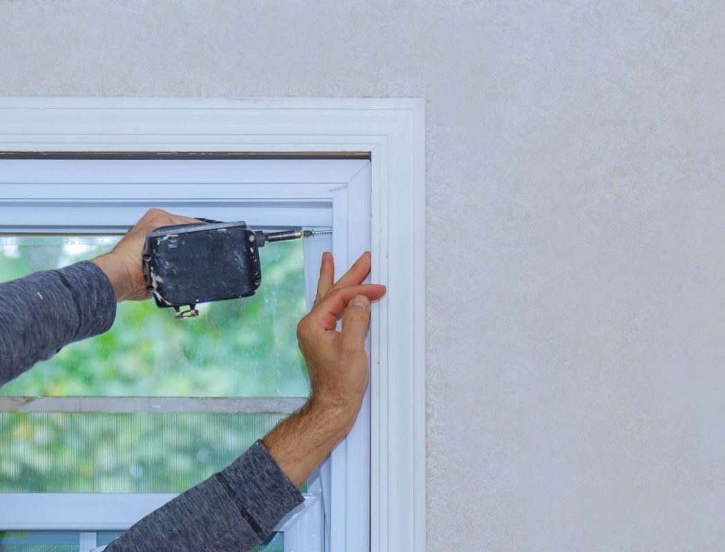 man-securing-window-frame-using-power-drill-indoor-2026-03-25-00-39-04-utc (1)